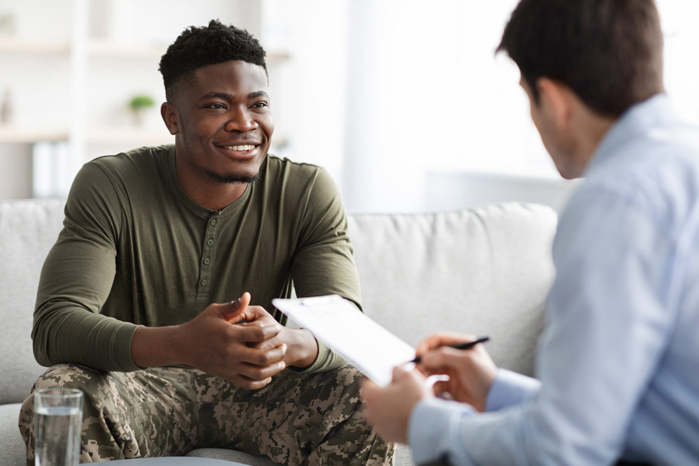 Young veteran meeting with a leadership development professional