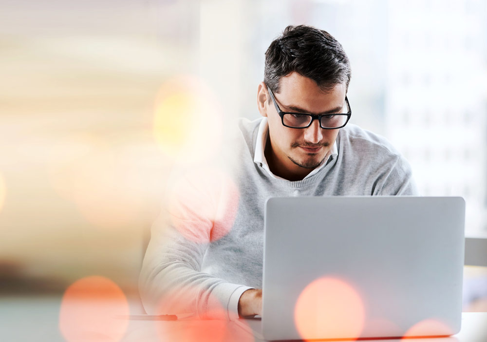 Young man working at his laptop