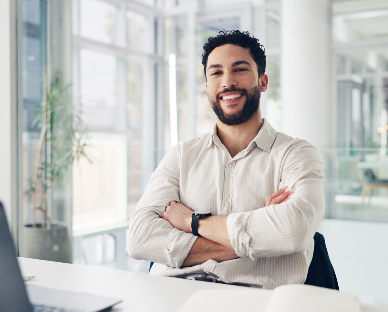 satisfied young businessman at his desk